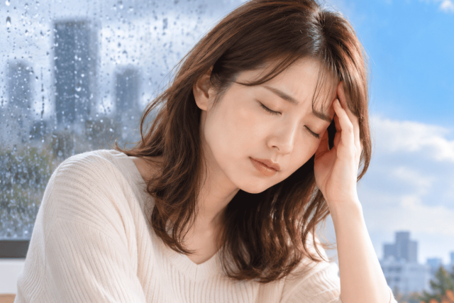 長雨で頭痛